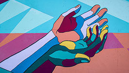 Grafity: Betende Hände in Regenbogenfarben