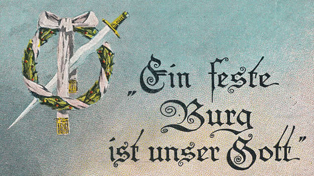 Ausschnitt aus einer Feldpostkarte mit dem Schriftzug des Choraltitel 'Ein feste Burg ist unser Gott' von Martin Luther