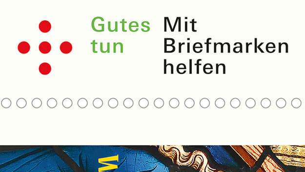 Schriftzug auf der Weihnchtsmarke: 'Gutes tun. Mit Briefmarken helfen'