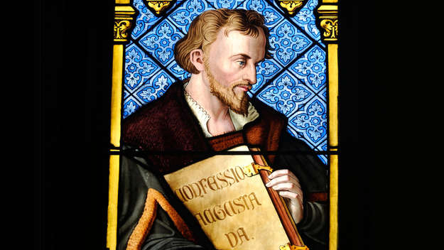  Church window shows Philipp Melanchthon with his 'Confessio Augustana'in the Heidelberger Peterskirche.