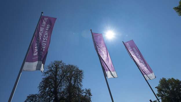 Flags in front of the building of the Protestant Church in Germany in Hannover